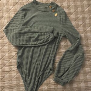 Green long sleeved body suit